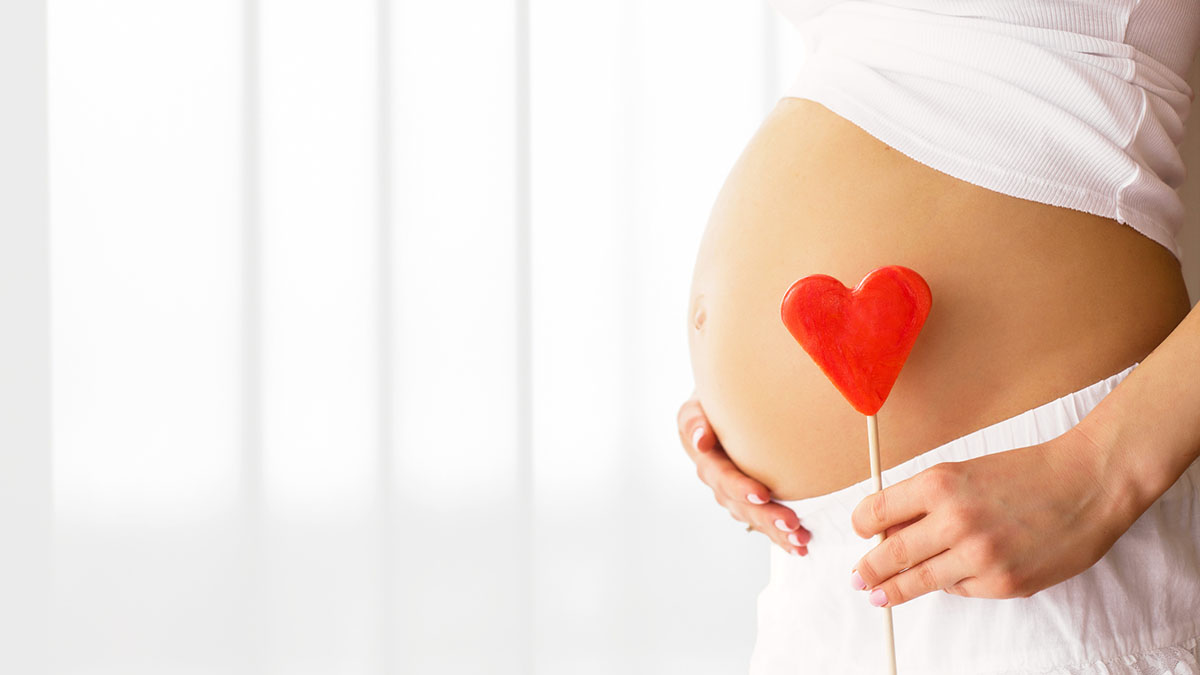 Heart and pregnant belly