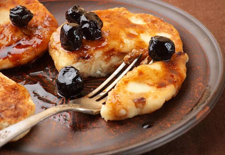 cottage cheese pancakes with fruit and syrup