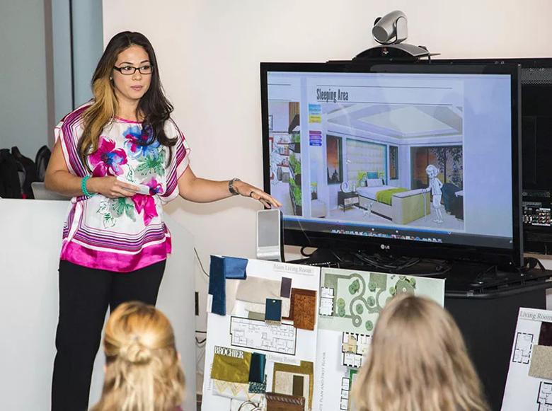 A student in the UNLV Master of Healthcare Interior Design Program presents a project to fellow students and Cleveland Clinic staff.
