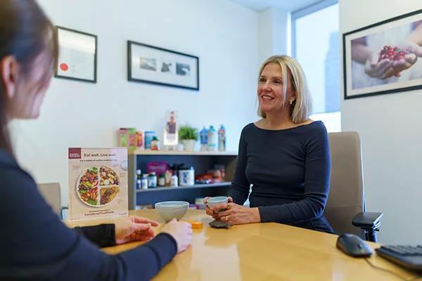Patient consulting with weight management provider.