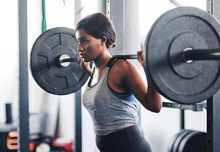 A group of people enjoy the gym eating food Stock Photo