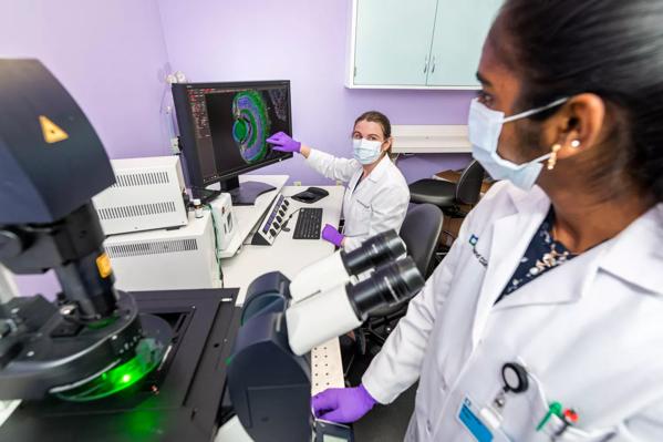 Two Cleveland Clinic Caregivers working in a lab.