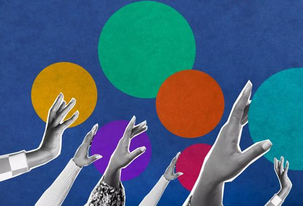 women's hands reaching for colorful circles