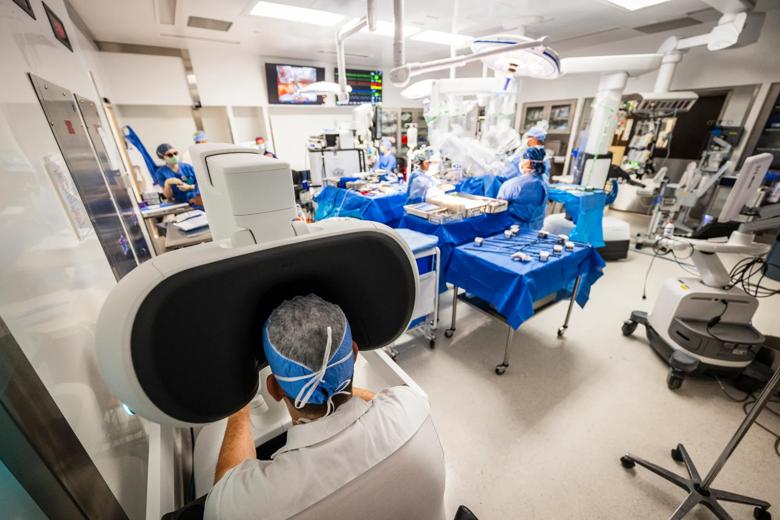 operating room with a robotic surgical system at the operating table