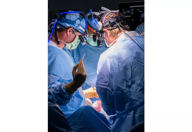 Drs. Phillips, Najm and Cass at work during the tumor resection.