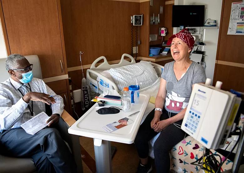 Patient and chaplain sharing a light moment