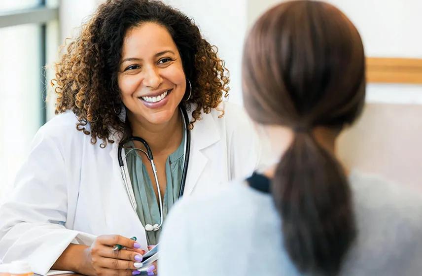 A caregiver talking to a patient.