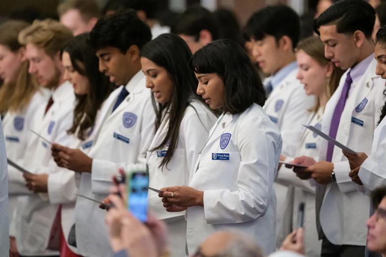 Students taking their Oath of Professionalism.