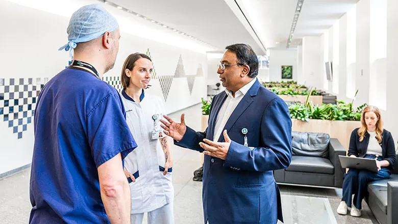 Cleveland Clinic providers talking to each other in a hallway