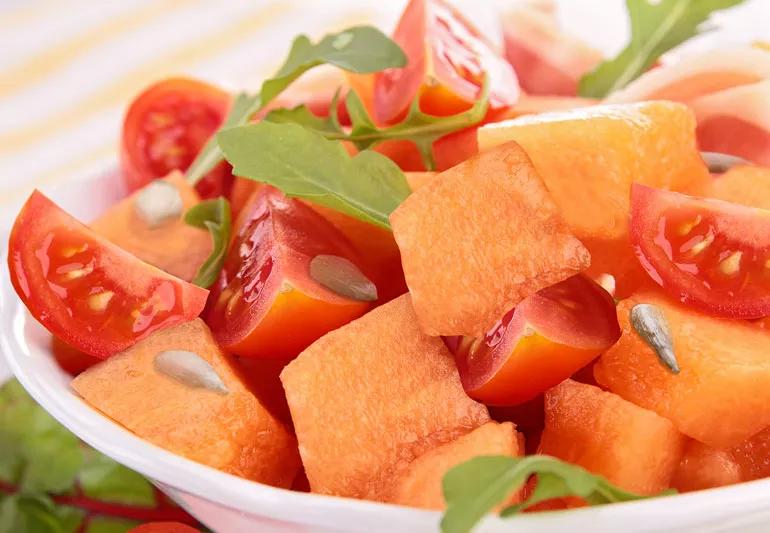 Cantaloupe, tomatoes and pumkin seed salad