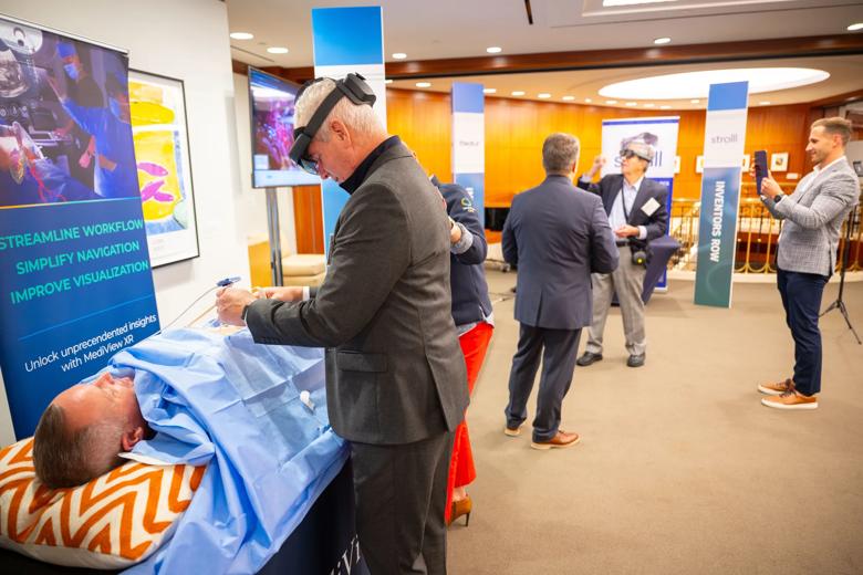 An Inside Innovations attendee interacts with a MediView demonstration.