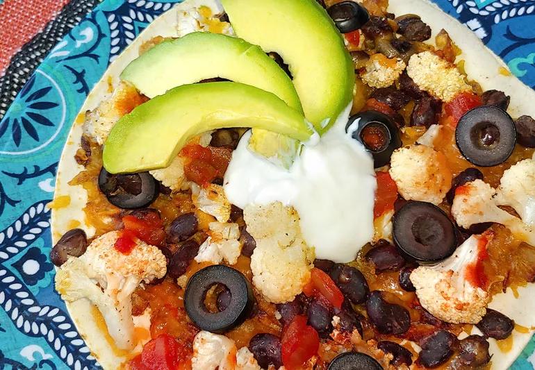 Black bean and sweet potato tostadas with roasted cauliflower