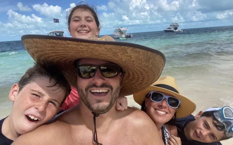 Dr. Benedetto and his family sport sun hats in the Bahamas