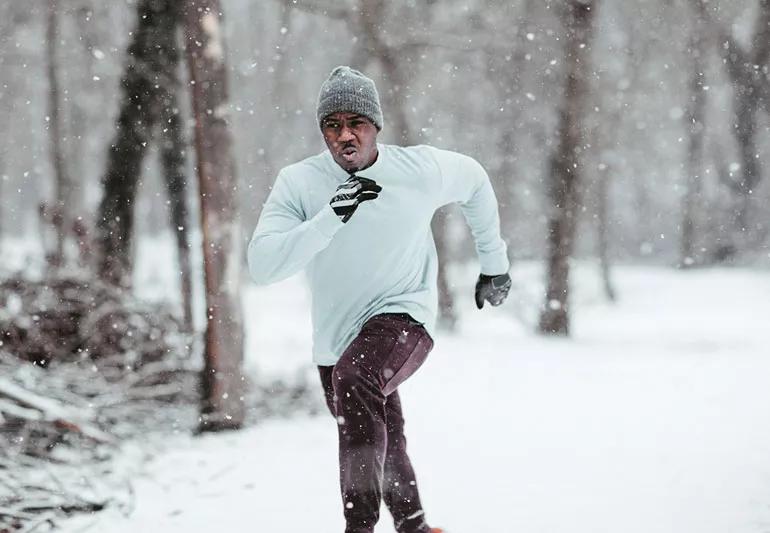man running in the snow