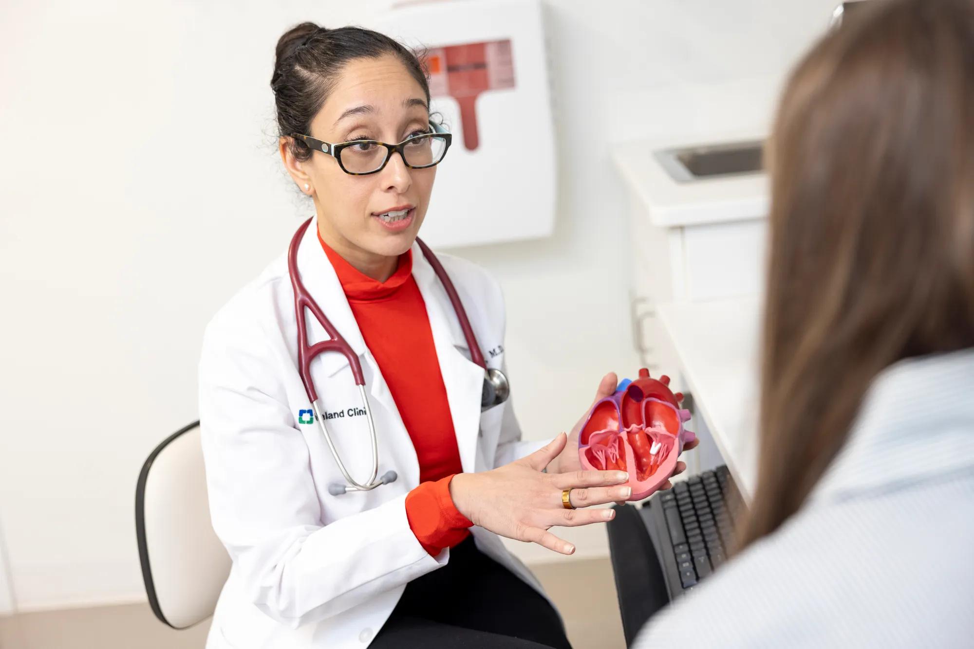 Doctor Tamanna Singh talking to a patient about a heart