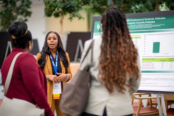 Students at medical education conference poster session