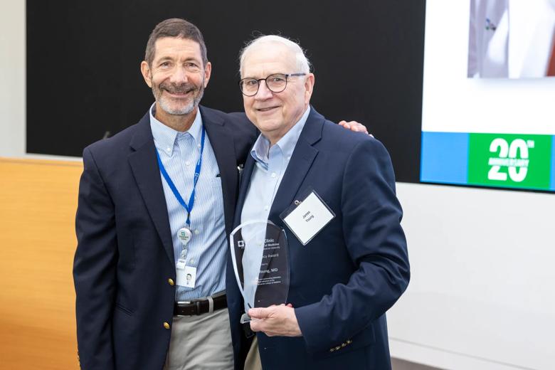 Dr. Isaacson presented former CCLCM Executive Dean James B. Young, MD with a CCLCM Legacy Award. 