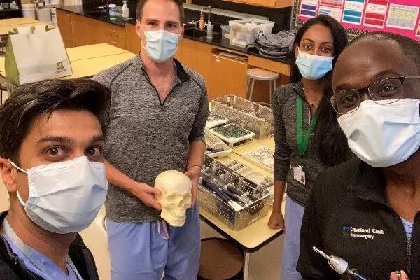 Four neurosurgery residents pose for a picture.