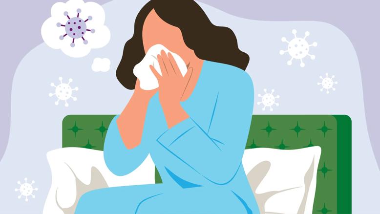 Person sitting up in bed blowing their nose, with germs floating around