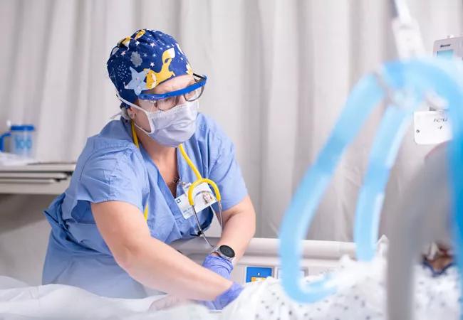 Physician with patient in ICU