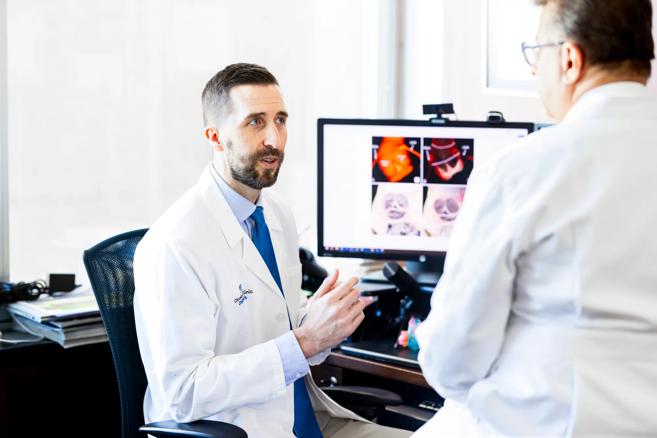 Dr. Tretter in conversation with Dr. Najm