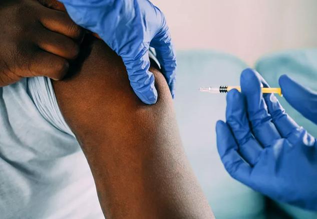 Person getting a flu shot.