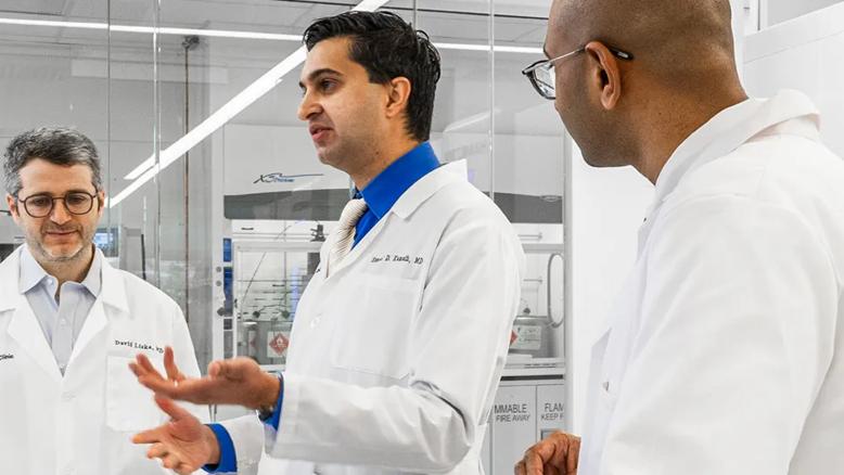 Dr. Kamath & colleagues in the lab