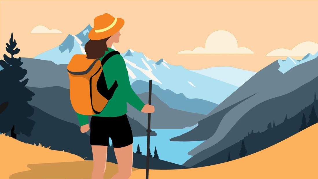 Person with hat, backpack and hiking stick admiring a mountain view