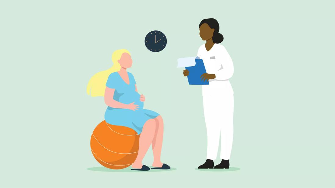 healthcare provider speaking with a pregnant woman sitting on exercise ball