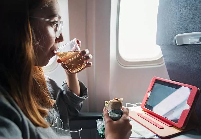 person eating on a plane