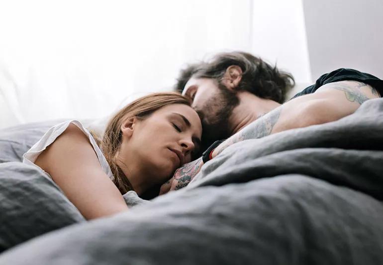 Couple sleeping together