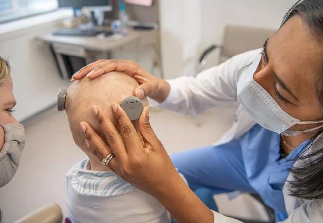 7 month old infant receiving cochlear implants