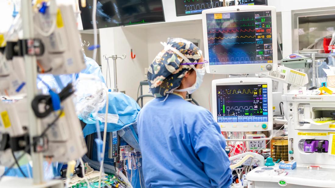 Nurse surrounded by monitors