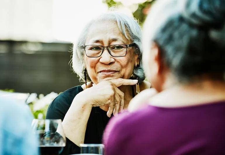 two elderly woman socialize after being vaccinated