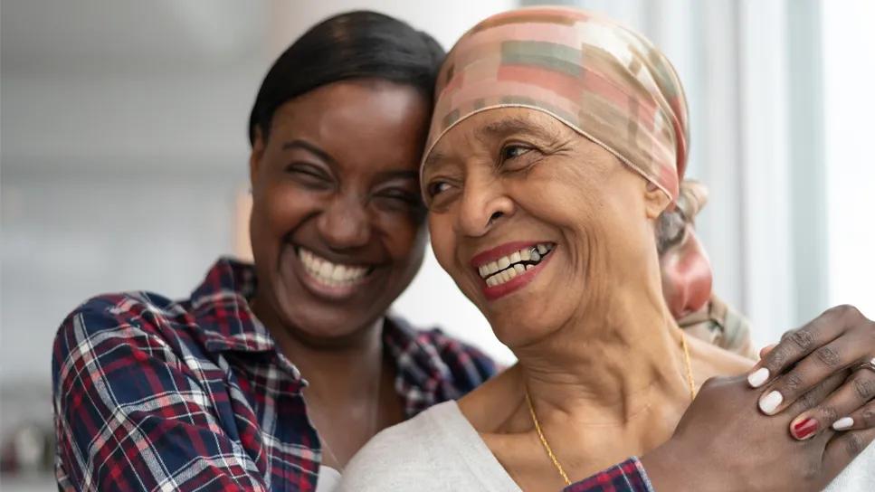 Cancer patient being hugged by a loved one