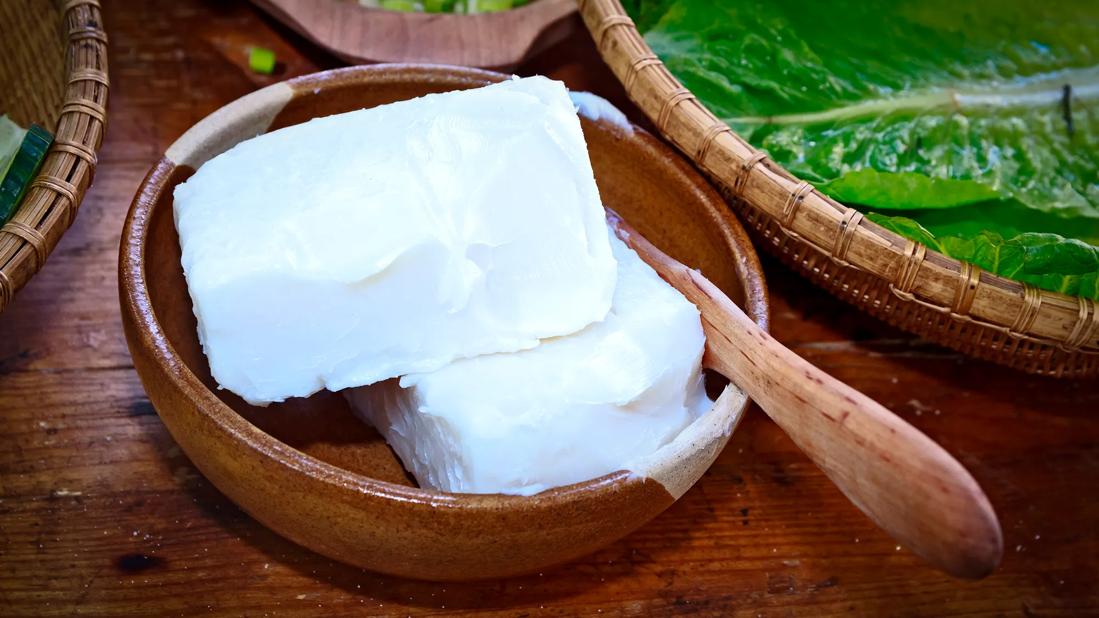 Chunks of beef tallow in wooden bowl