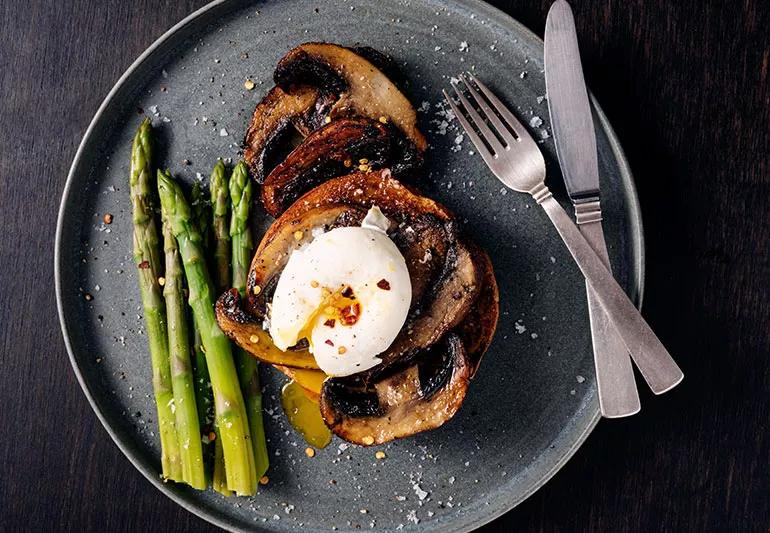 Poached eggs over roasted mushrooms and asparagus