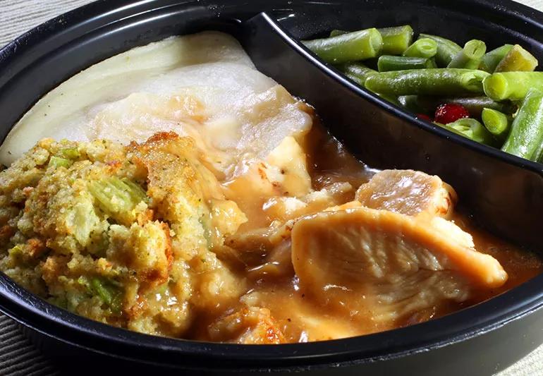 Microwave meal of turkey with gravy, stuffing, and green beans