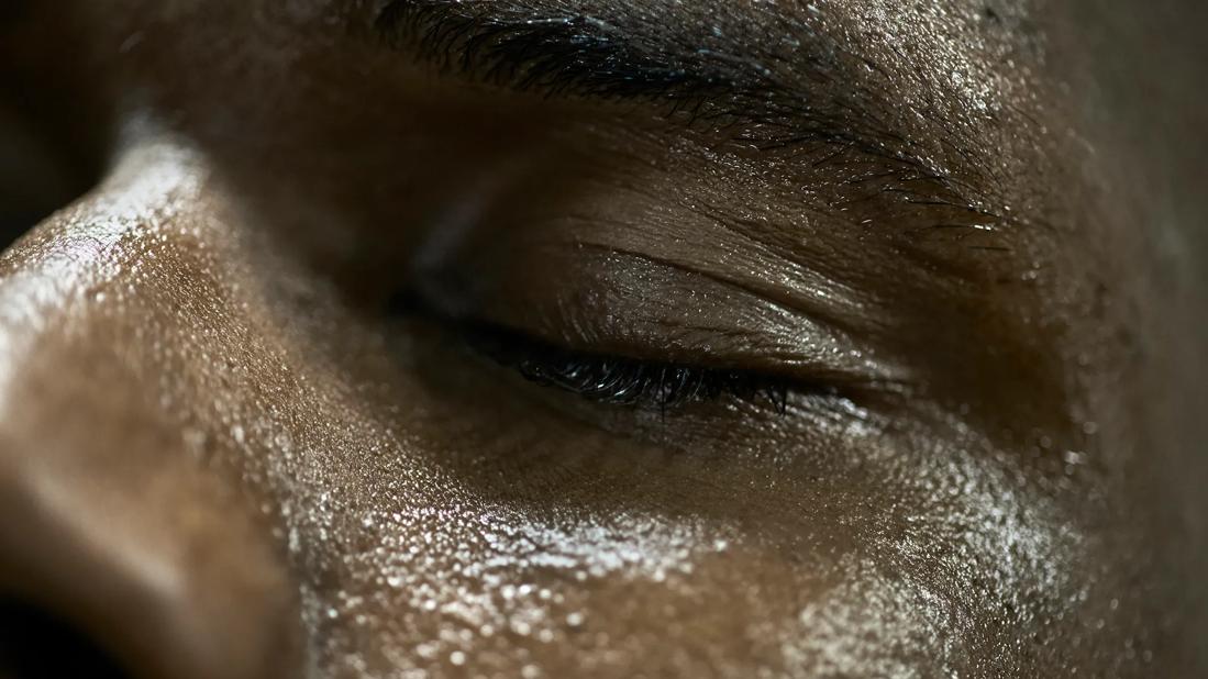 Close up of face, sweating, eyes closed