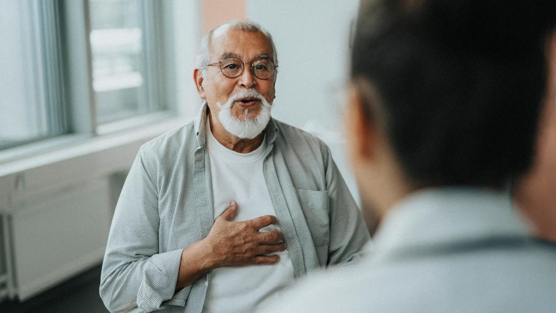 Person talking with healthcare provider in office