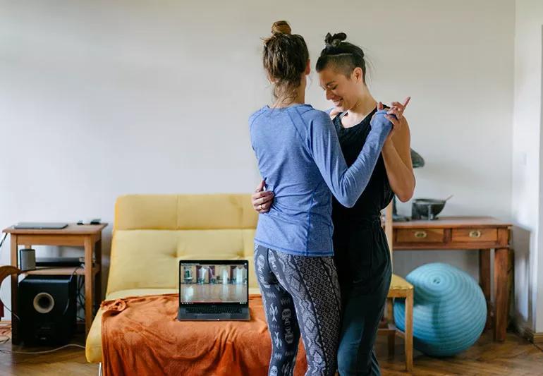 A couple slow dances in their living room.