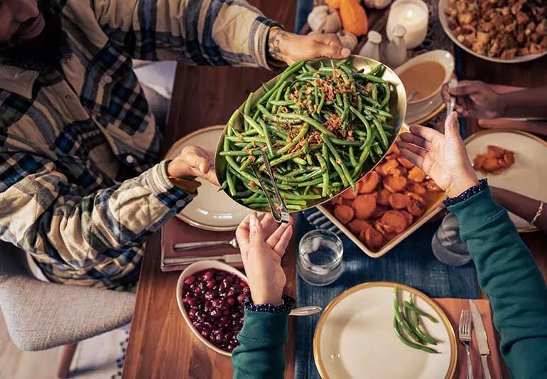 family table at holidays sharing food