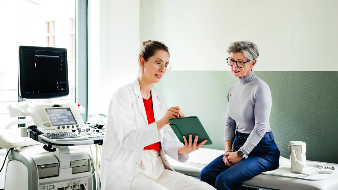 Healthcare provider going over ultrasound results with patient