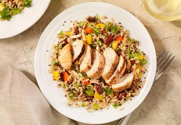 Plate of chicken, vegetables and grain