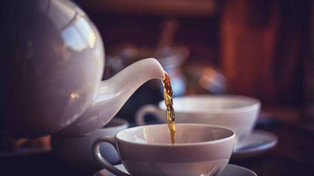 Cup of Black Tea Served with Biscuits