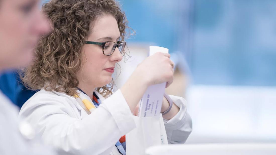 Pharmacist packing medication