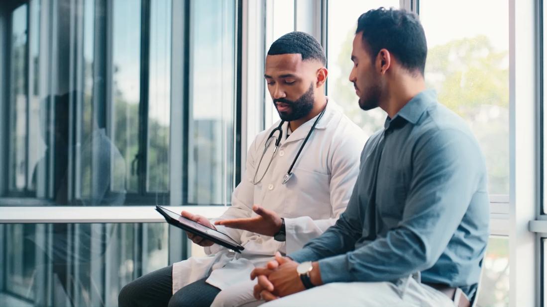 Physician speaking with patient