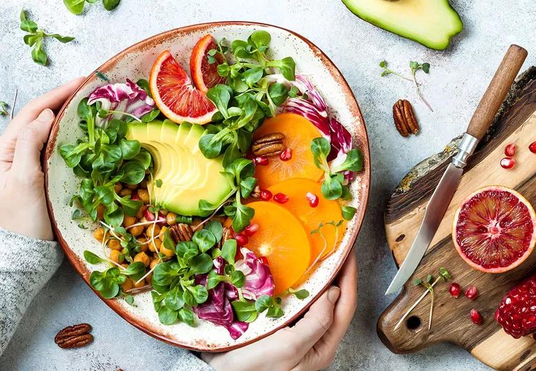 eating veggies in a buddha bowl