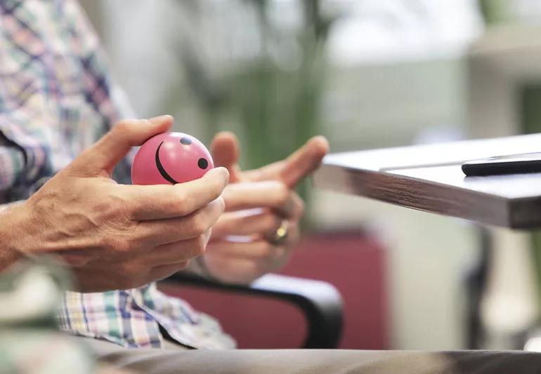 man keeping his hands busy using a stress ball