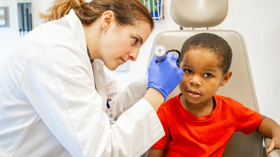 Child undergoing ear exam
